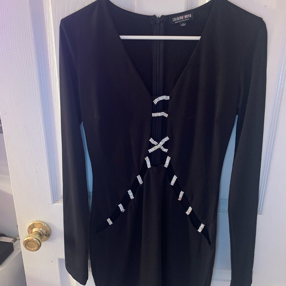 Black long sleeve dress with cut outs on the rhinestones